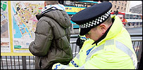 Police officer conducts stop and search