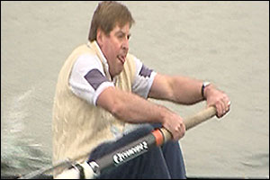 Edward Stourton rowing fast.