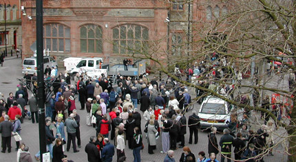 Concern - hundreds of people begin to gather to attend a vigil at Derry's Guildhall