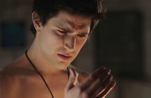 Kyle looking at his hand