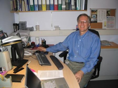 Andrew at his desk