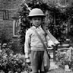 This is a picture of the author, with the wooden gun made for him by his father. Pic taken while staying in Leicester.