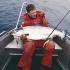Jesper Fohrmann with his salmon caught by trolling a dead herring – it took 50 minutes to bring aboard