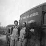 Margaret and Nancy on the farm in their working dungarees.