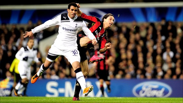 Tottenham's Sandro grapples with AC Milan's Zlatan Ibrahimovic