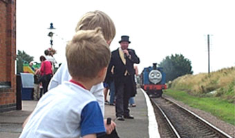 Thomas arrives, overseen by Sir Topham Hat