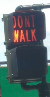 The iconic 'walk' and 'don't walk' signs have disappeared from New York City's pedestrain crossings. We found this on our recent visit upstate, to Poughkeepsie.