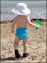 Child at the water's edge