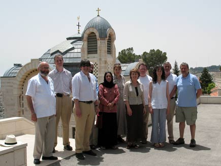 Daily Service contributors standing in front of sunlit church domes. Left to right: Rabbi Dr Alan Unterman, Philip Billson, Dr Ed Kessler, Dr Musharraf Hussain, Anjum Anwar, Becky Harris, Christine Morgan, Canon Chris Chivers, Charlotte Kirby, Ernie Rea and Phil Booth