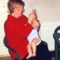 Lewis being fed at home by his mother Lynn