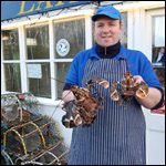 Robert holding two lobsters