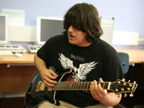 Umar playing the Guitar