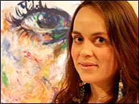 Emily Stokes and one of her paintings