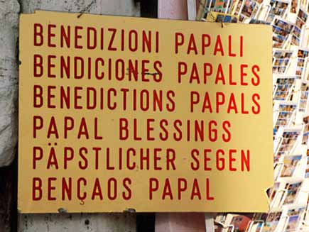 A notice advertises 'Papal blessings' in several languages