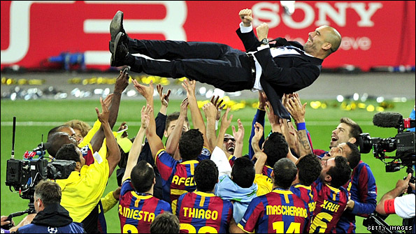 Pep Guardiola is launched into the air by the celebrating Barcelona players at Wembley