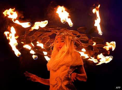 An artist plays with fire at the International Fire Festival in Kiev