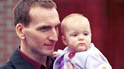 Joe (Christopher Eccleston) and baby Marie