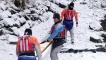 Carrying the kayaks through the snow.
