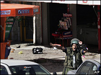 Israeli policeman at the scene of a suicide bombing in Dimona, Israel