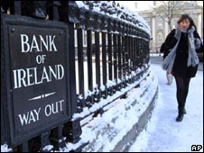 A woman walks past a branch of the Bank of Ireland in Central Dublin (28 Nov 2010)