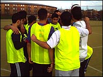 The team huddling together