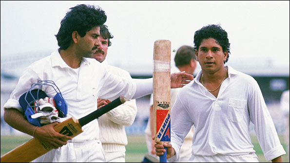 Sachin Tendulkar walks off the field after scoring a century against England at Old Trafford in 1990