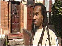 Benjamin outside a house