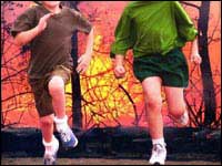 Children running away from fire