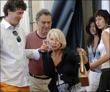 Dame Helen Mirren jokes with photographers at a news conference