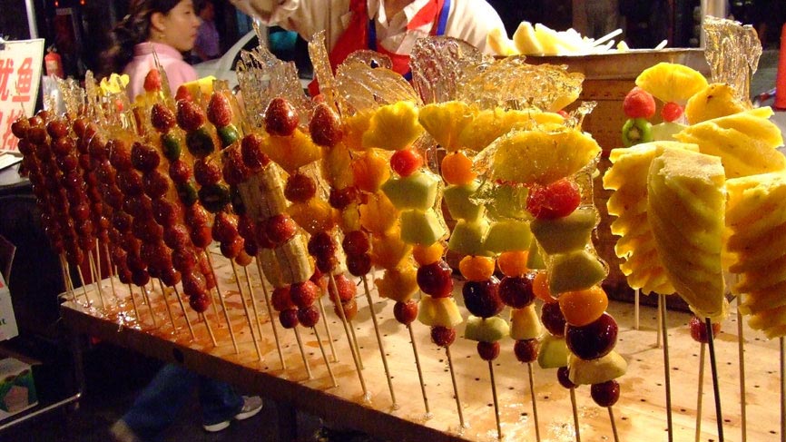 Glazed fruit kebabs.