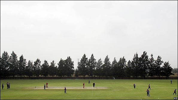 Afghanistan cricket players take positions during the match with Denmark