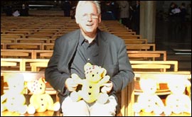 Pete Waterman with his autographed Pusdey toys 
