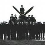 There were two women only Air Transport Auxiliary ferrypools. One at RAF Cosford, and Hamble. This was probably taken at Hamble. A Spitfire sits in the background.