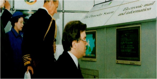 Ian Lauder demonstrates a Domesday Machine to the Queen and Prince Phillip.
