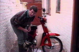 Conrad cleans his beloved bike