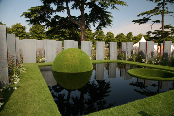 Grass domes representing relative prosperity in The World Vision Garden, Hampton Court Palace Flower Show 2011