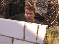 A man looking at a wall