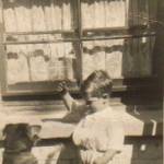 Terry, aged 3 and next doors dog Toby in Lowfield Road, Kilburn