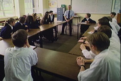 School children in classroom with a teacher