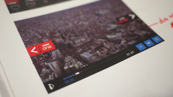 Printed mockup of a side-swipe arrows with BBC1 and BBC3 logos