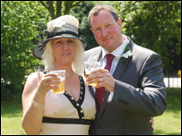 Rose and Phil Booth celebrate their marriage in an Ascot carpark.