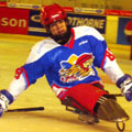 Nathan in action, playing sledge hockey