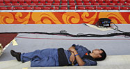 Sleeping worker in the Bird's Nest