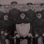 Gerry's Father is pictured centre holding the shield