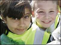 Youngsters working together to clean their area