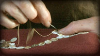 Sew buttons onto fabric