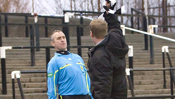 A assistant referee is confronted by an exuberant fan at Ayr's Scottish Cup match against Sunnybank on Saturday. Photo: SNS.