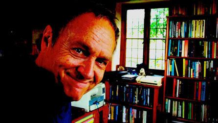 Phil Rickman surrounded by books