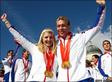 Rebecca Adlington and Chris Hoy show off their medals during Team GB's homecoming parade in London