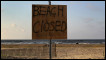 A sign warns the public away from the beach on Grand Isle, Lousiana. John Moore/Getty